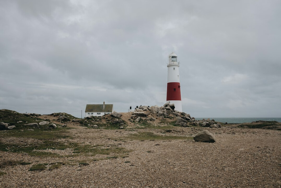 White lighthouse on a rocky coast in Rocha Uruguay