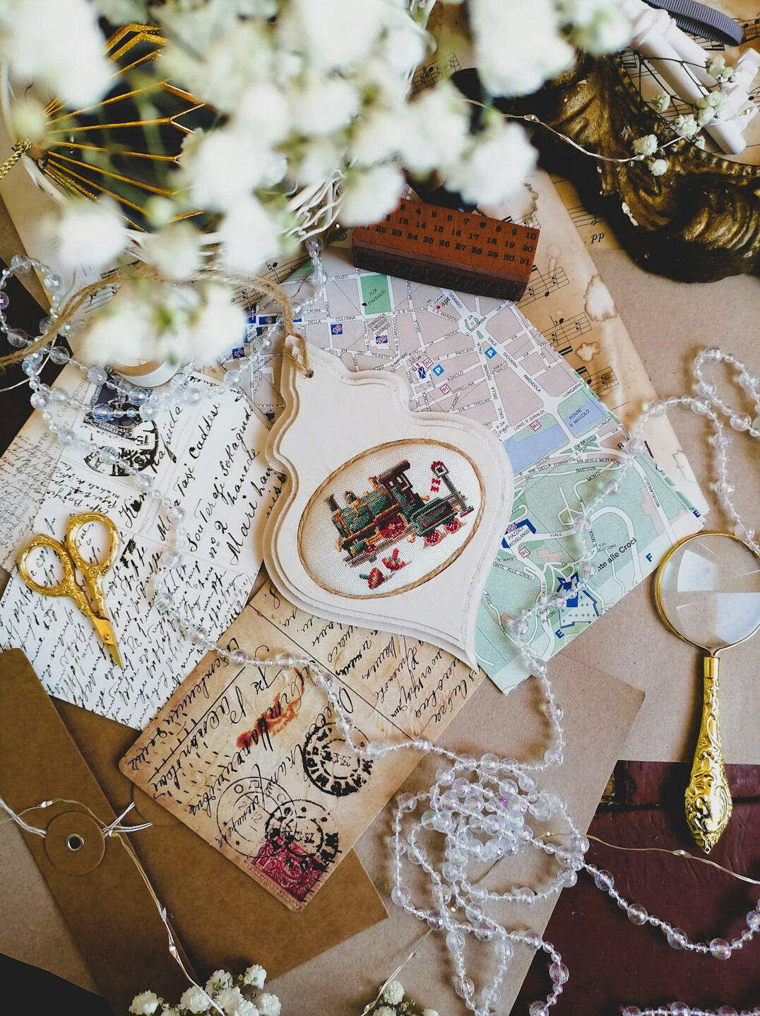 Detective desk with magnifying glass, old letters and notebook