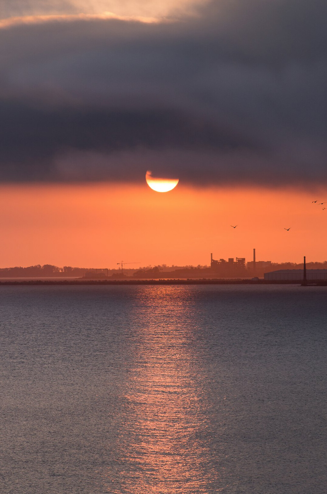 Montevideo Rambla seafront promenade at sunset under dramatic clouds