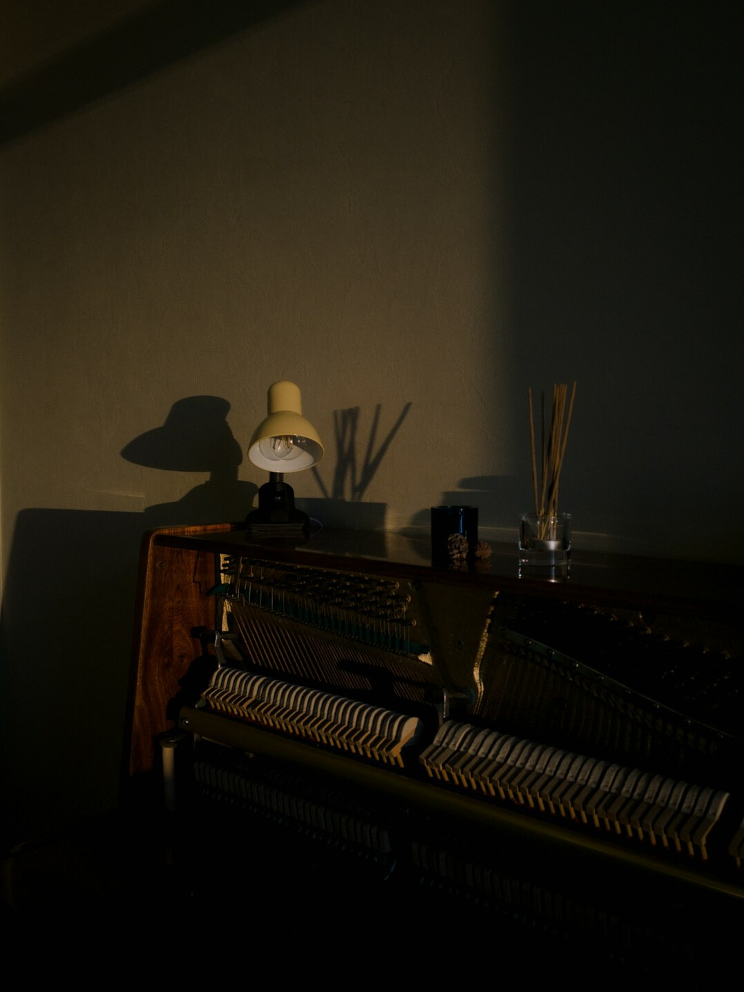 Vintage typewriter with a sheet of paper next to a desk lamp